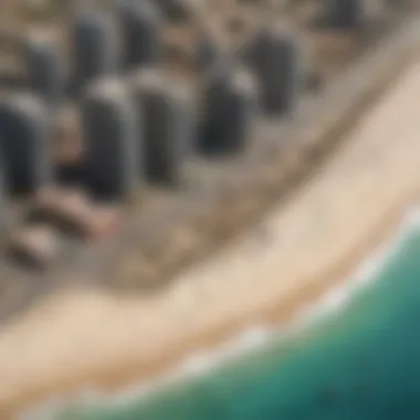 Aerial Perspective of Al Souf Beach An aerial perspective of Al Souf Beach, capturing its unique shape and the surrounding urban development.