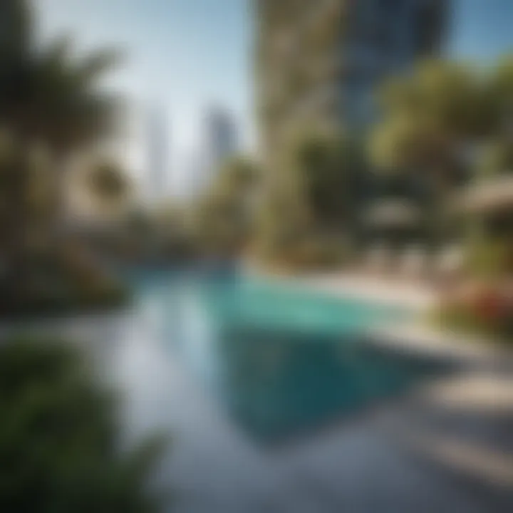 Outdoor swimming pool at BM Tower surrounded by lush green landscaping