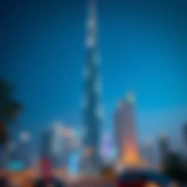 Night view of Al Saqran Tower illuminating the Dubai skyline