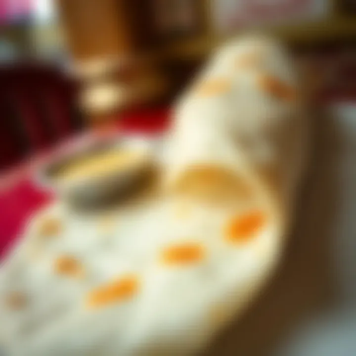 A close-up of a traditional dosa served at Saravana Bhavan.